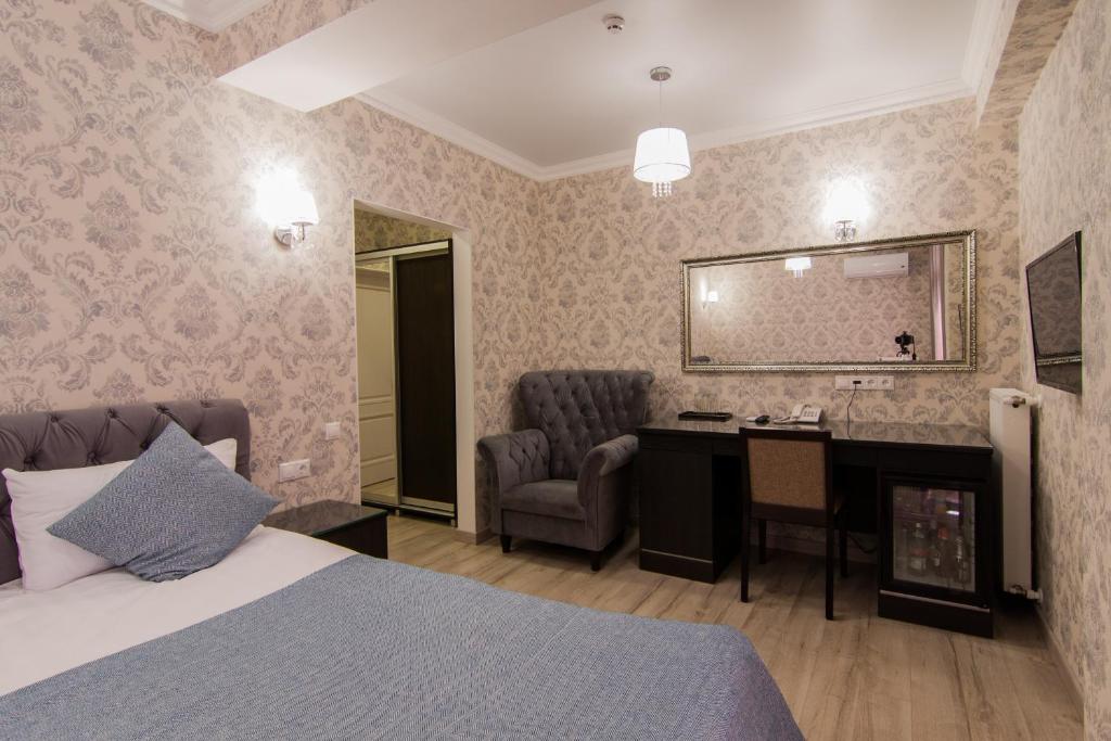 Postel nebo postele na pokoji v ubytování Klassik Hotel