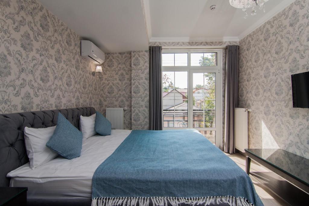 Postel nebo postele na pokoji v ubytování Klassik Hotel