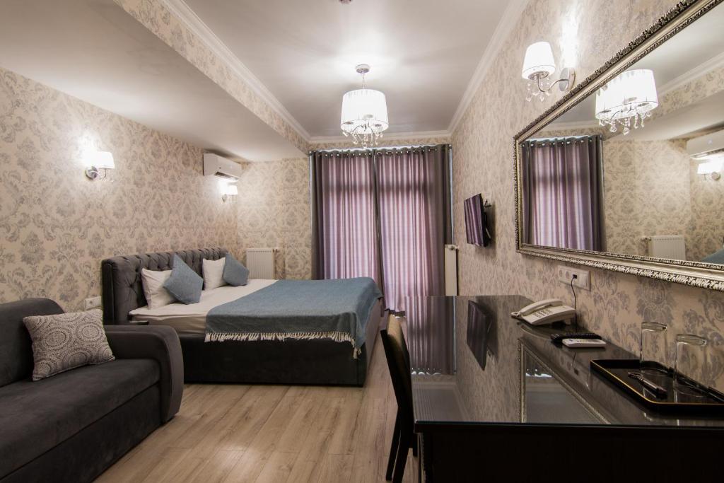 Postel nebo postele na pokoji v ubytování Klassik Hotel
