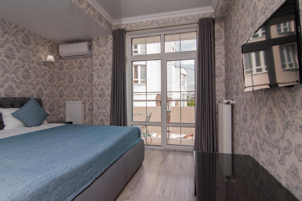 Postel nebo postele na pokoji v ubytování Klassik Hotel