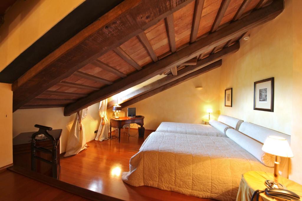 Letto o letti in una camera di Hotel Casa Pavesi