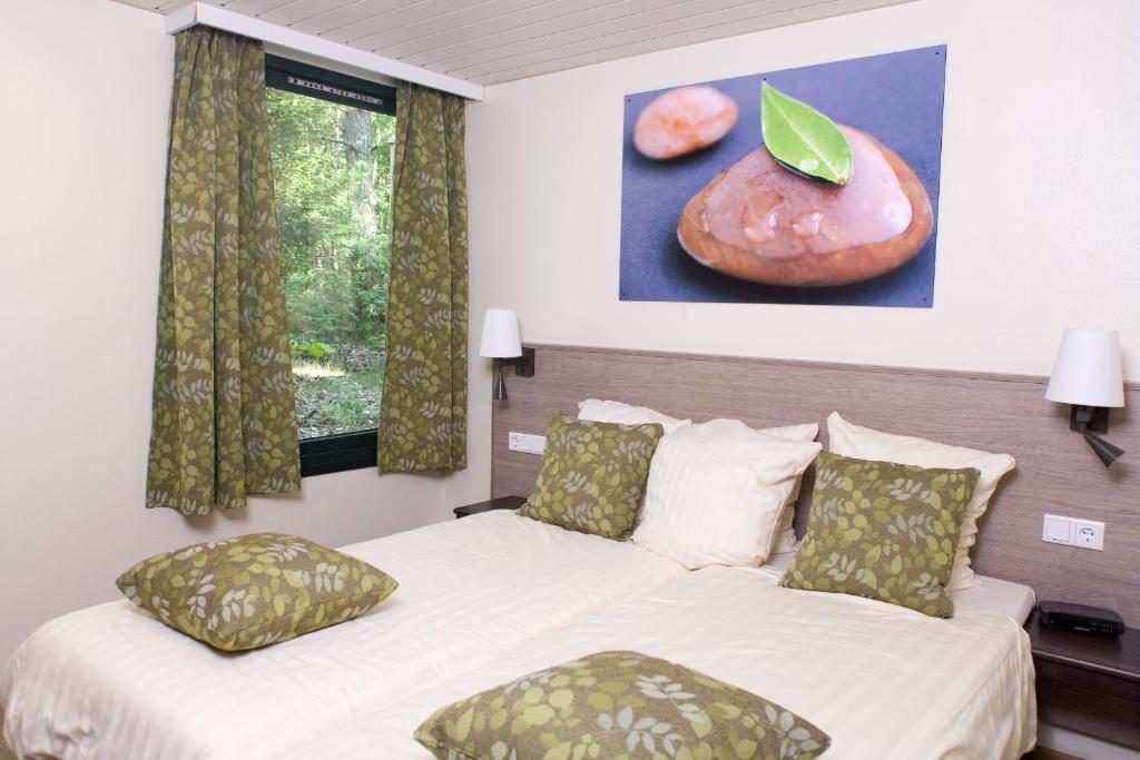 Postel nebo postele na pokoji v ubytování Center Parcs Bispinger Lüneburger Heide