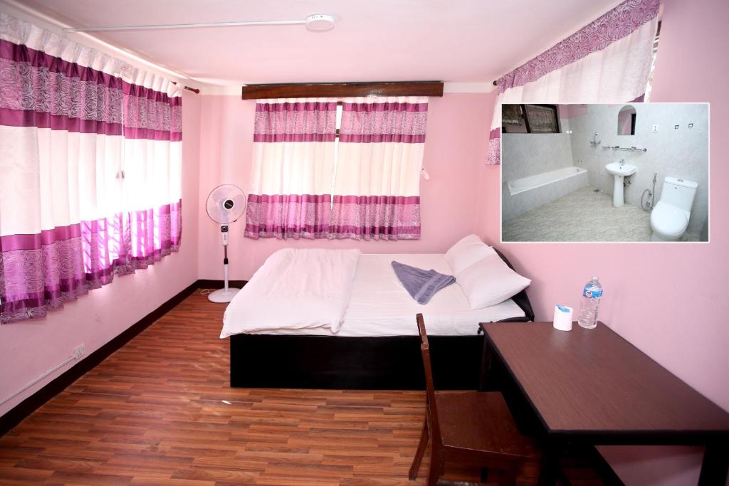 Postel nebo postele na pokoji v ubytování Mitra Garden Inn