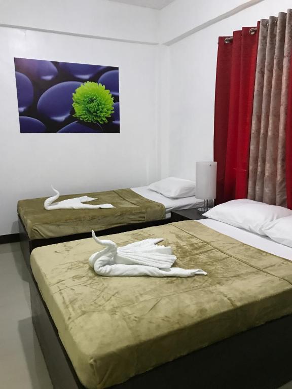 Postel nebo postele na pokoji v ubytování 4C's Tourist Lodge
