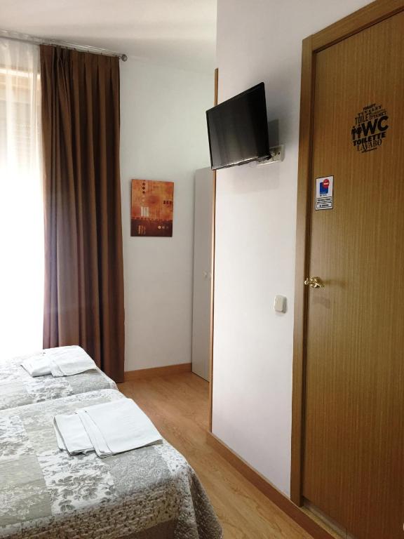 Una cama o camas en una habitación de Alojamiento Jaén