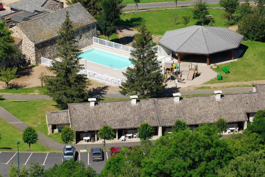 an aerial view of a building with a swimming pool at VVF Haute Loire Saint-Julien-Chapteuil in Saint-Julien-Chapteuil
