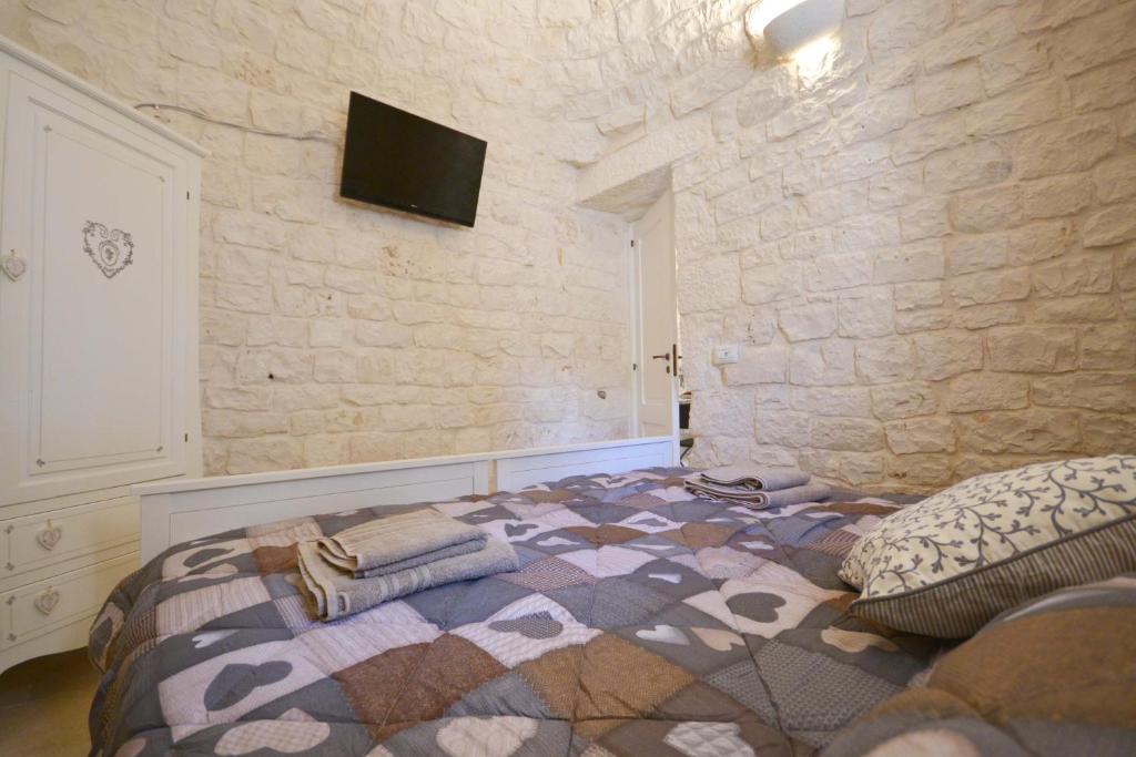 TV a/nebo společenská místnost v ubytování Trulli Petra Chiara