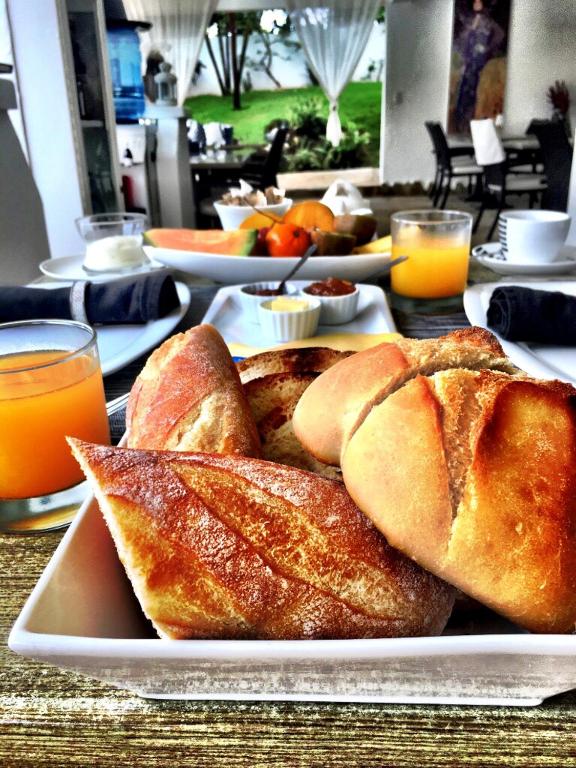 a plate of food with bread on a table at Casa Veintiuno in Sosúa