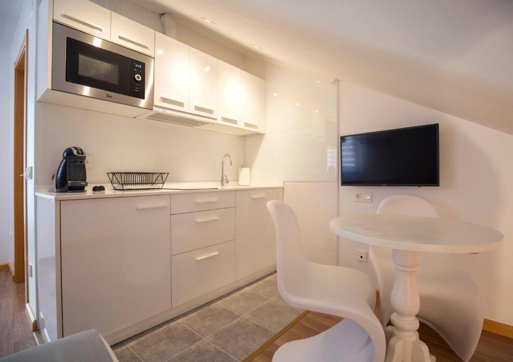 Kuchyňa alebo kuchynka v ubytovaní Apartamentos Ele San Justo Plaza