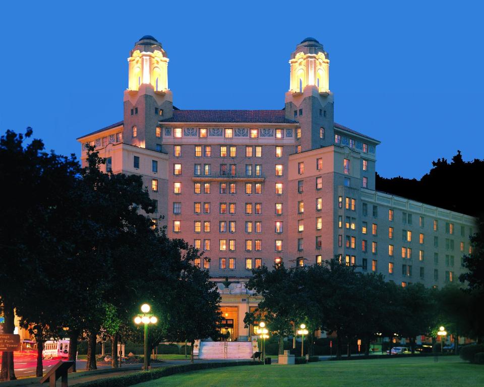 a large building with lights on top at night at Arlington Resort Hotel & Spa in Hot Springs