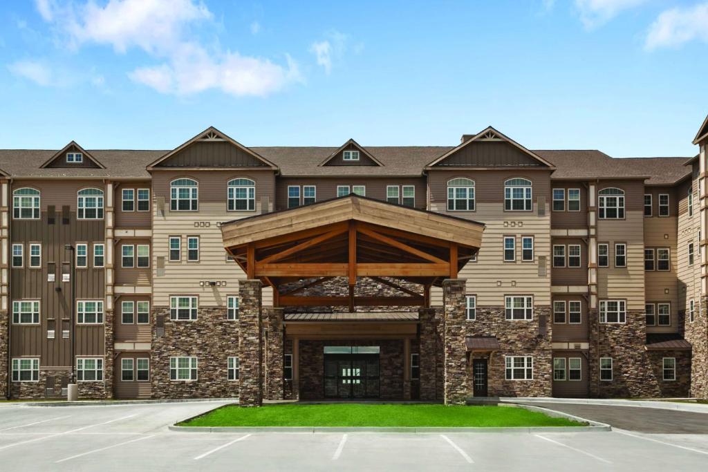 
a large building with a large clock on it at Hyatt House Minot- North Dakota in Minot
