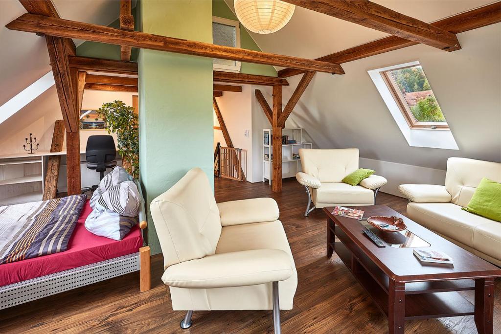 a living room with a couch and a table at Ferienwohnung Schulze in Freital