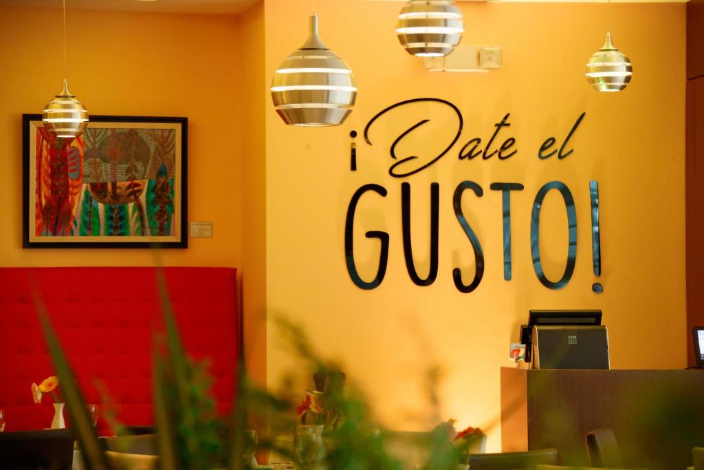 a restaurant with a sign that reads take a guess at Hotel Ciudad de David in David
