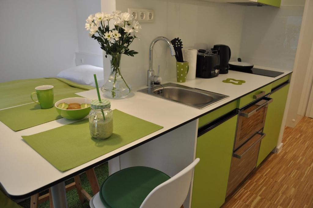 Kuchyňa alebo kuchynka v ubytovaní Studio Apartments City&style