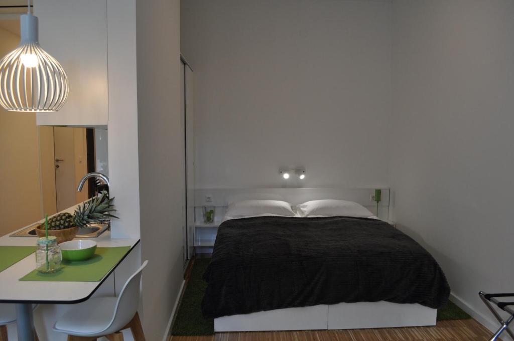Posteľ alebo postele v izbe v ubytovaní Studio Apartments City&style