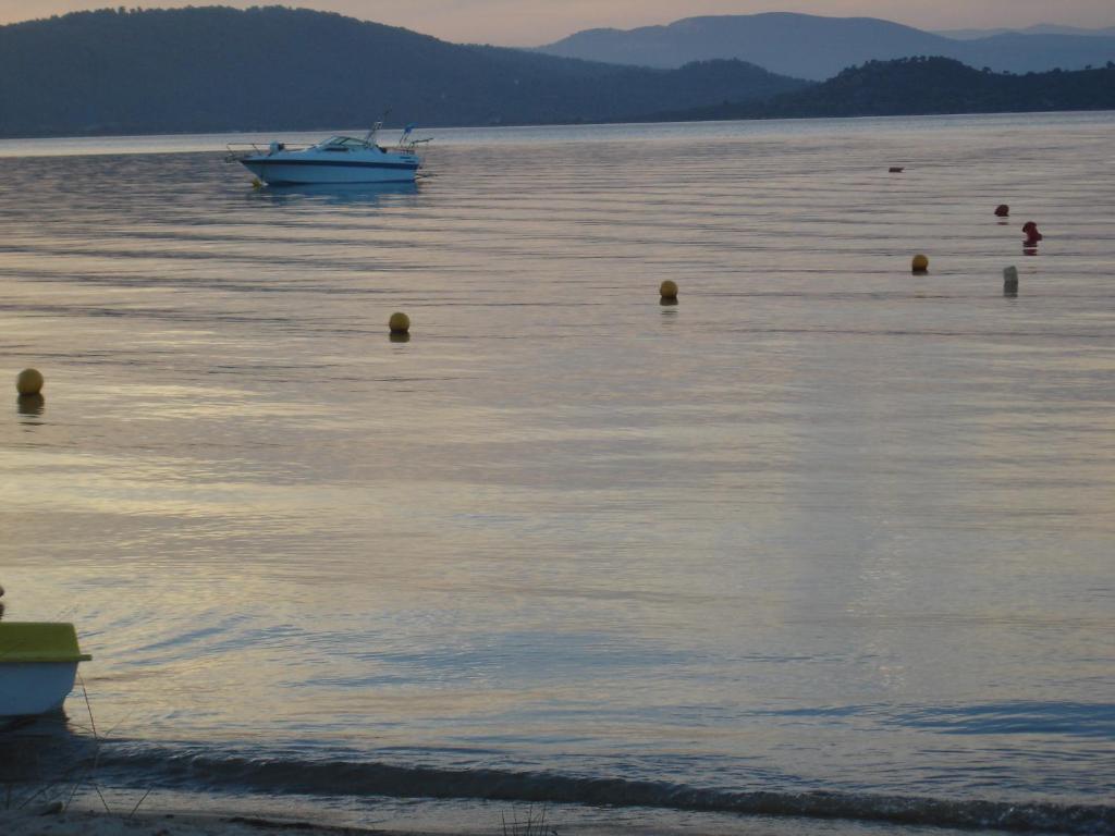 a boat in a large body of water at Maria Village in Vourvourou