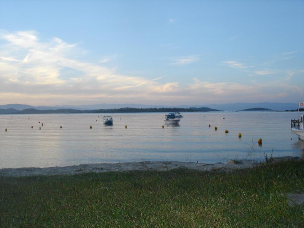 a large body of water with boats in it at Maria Village in Vourvourou
