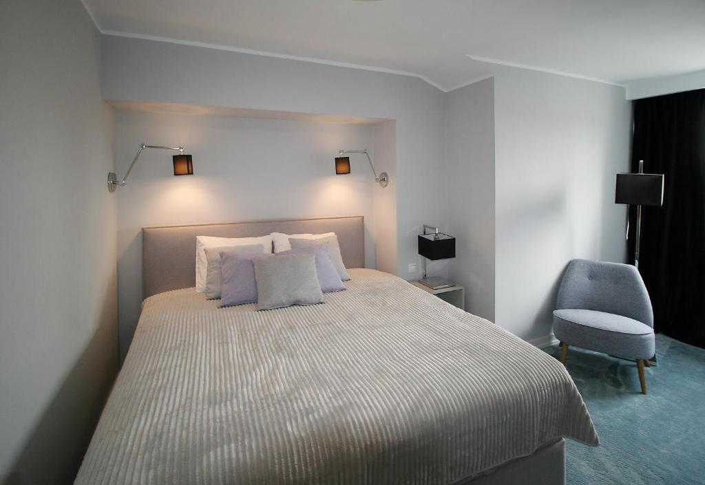 Posteľ alebo postele v izbe v ubytovaní Apartament Mozart