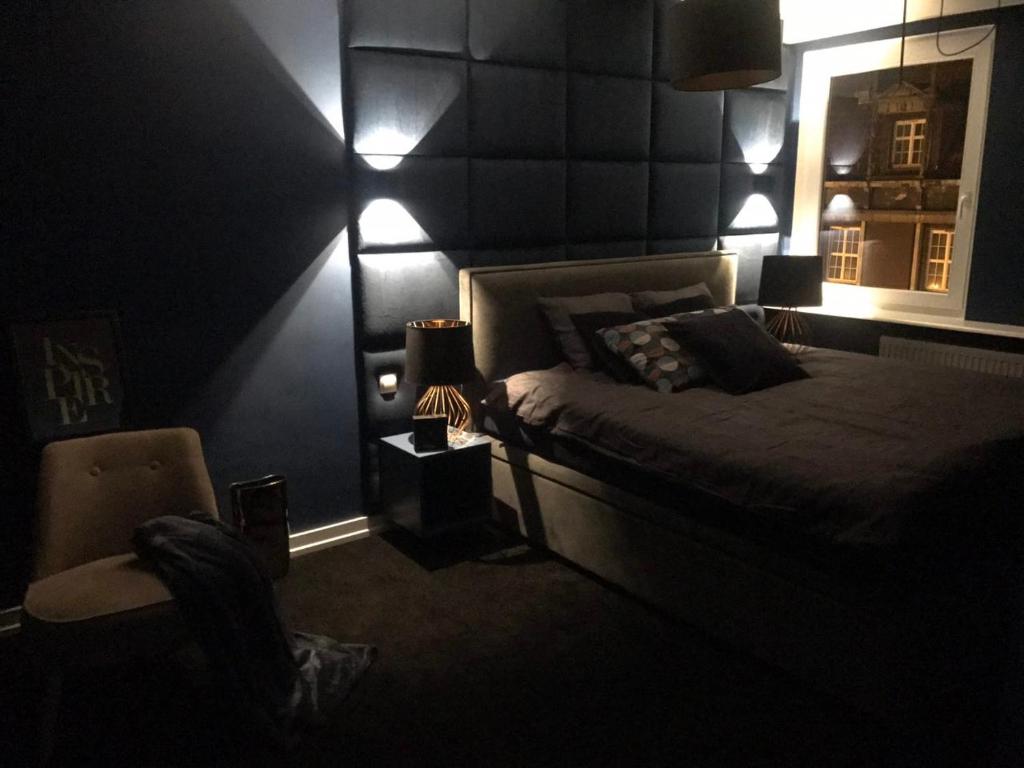 Posteľ alebo postele v izbe v ubytovaní Apartament Mozart
