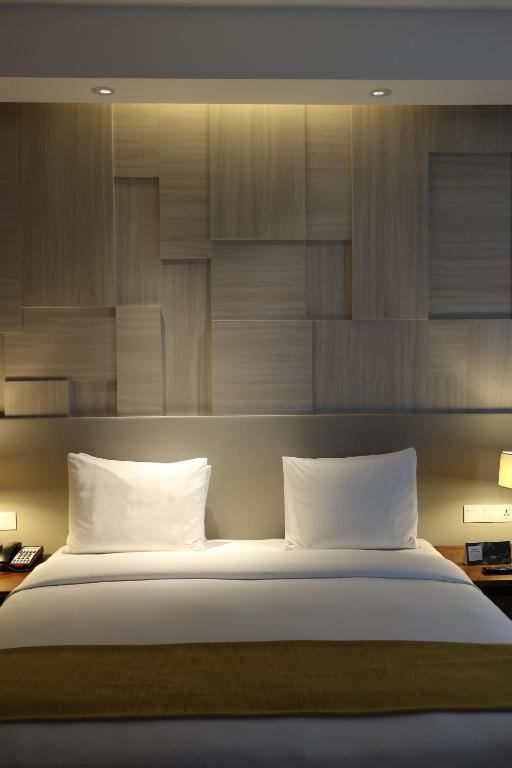Postel nebo postele na pokoji v ubytování Crowne Plaza Bandung by IHG
