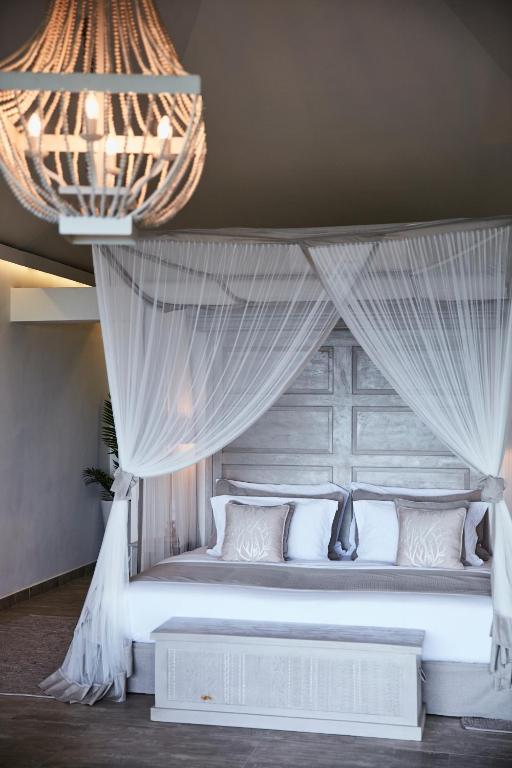 Postel nebo postele na pokoji v ubytování Zawadi Hotel, Zanzibar