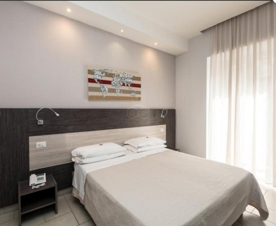 Posteľ alebo postele v izbe v ubytovaní Napoli Suite