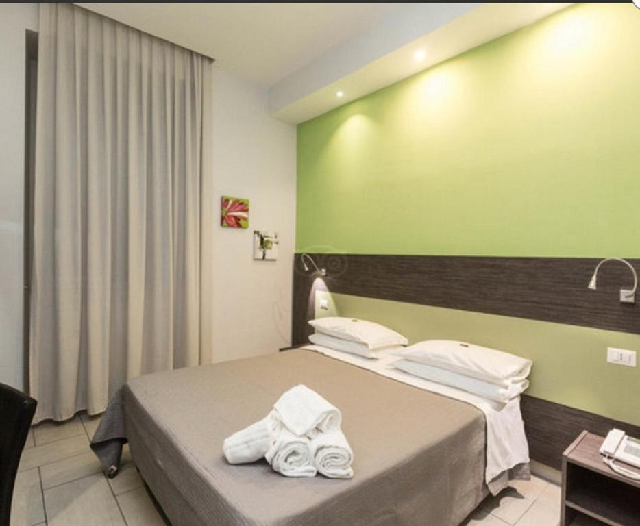 Posteľ alebo postele v izbe v ubytovaní Napoli Suite