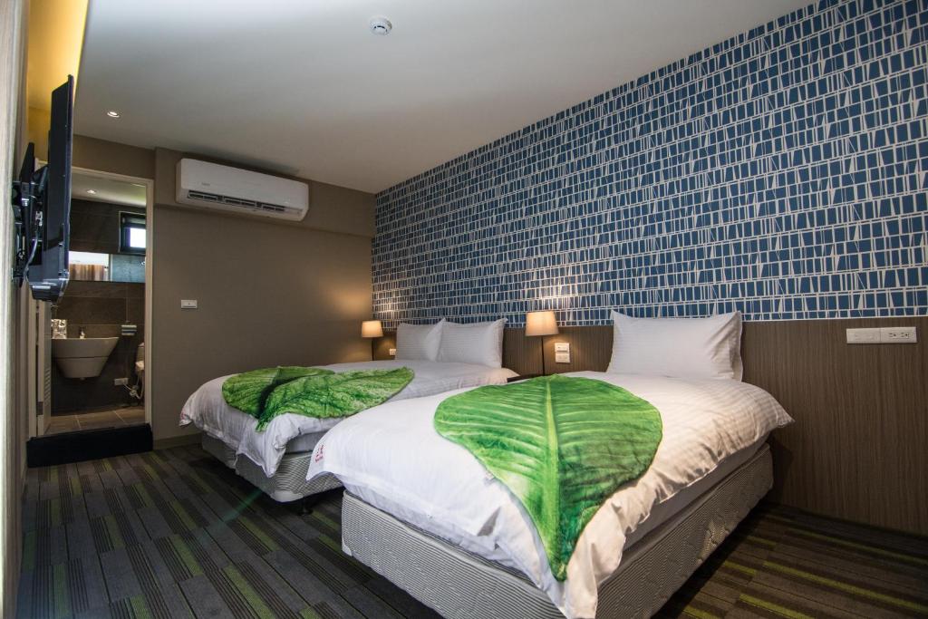 Ένα ή περισσότερα κρεβάτια σε δωμάτιο στο San Yuan Guest House