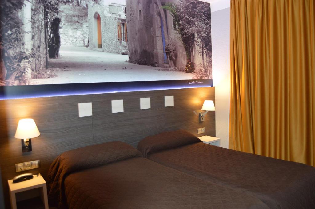 Postel nebo postele na pokoji v ubytování Hotel Ciutadella