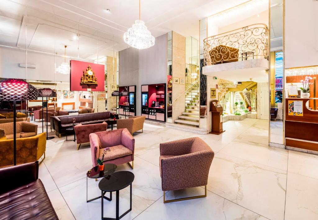 a lobby of a store with chairs and tables at Hotel City Central in Vienna