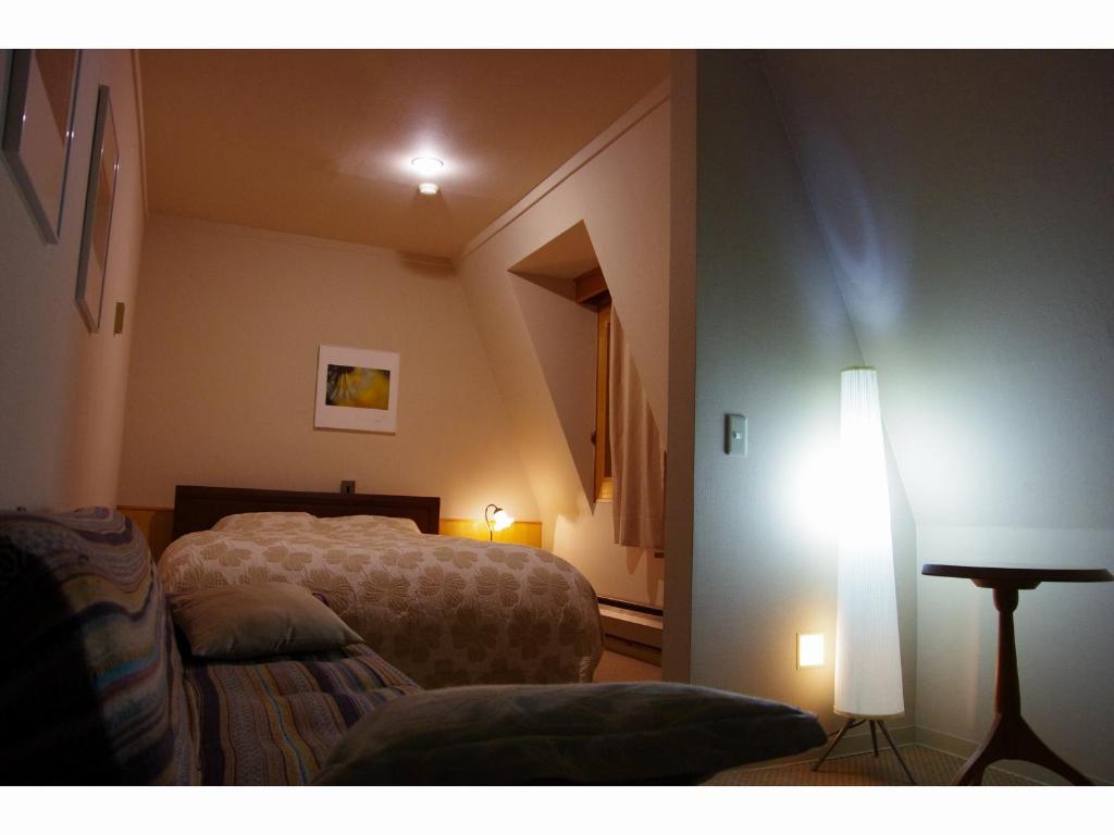 Postel nebo postele na pokoji v ubytování Resort Garni CORU
