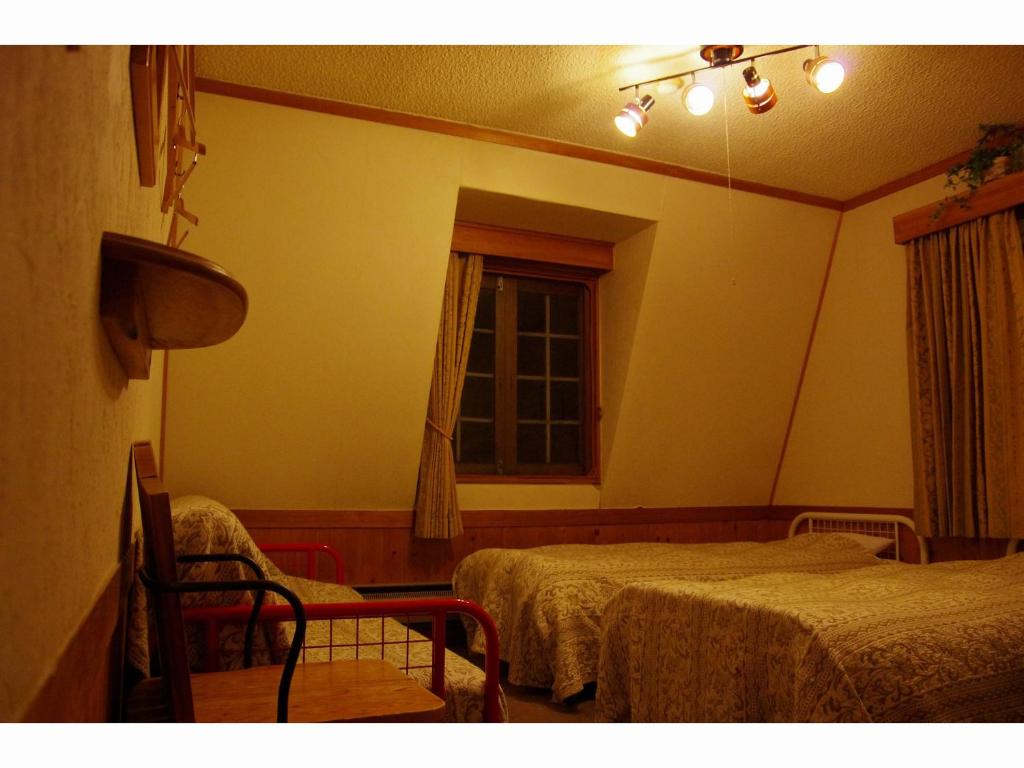 Postel nebo postele na pokoji v ubytování Resort Garni CORU