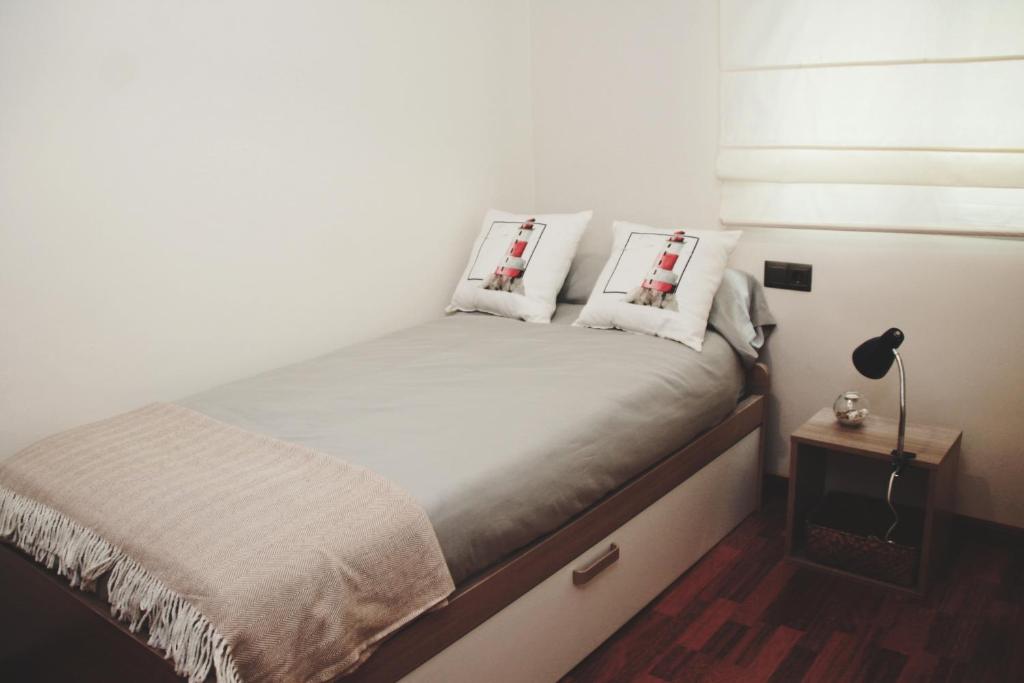 En eller flere senge i et værelse på Apartamento céntrico, Enriqueta Ortega