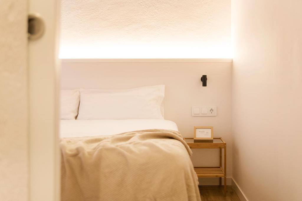 Postel nebo postele na pokoji v ubytování Decô Apartments Barcelona-Born Apt.