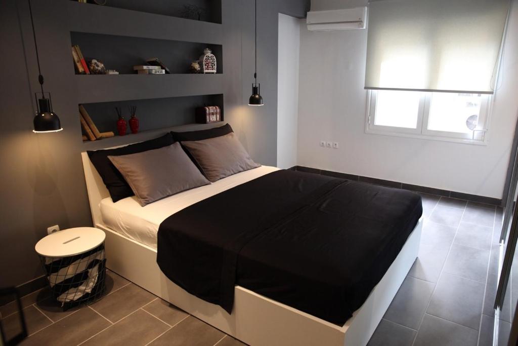 A bed or beds in a room at Super Stylish Apartments in Syntagma Square!