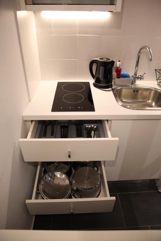 A kitchen or kitchenette at Super Stylish Apartments in Syntagma Square!