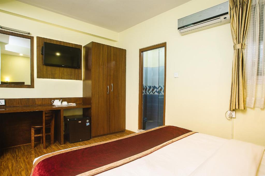 Postel nebo postele na pokoji v ubytování Backyard Hotel