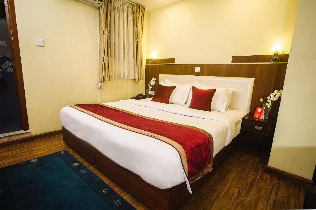 Postel nebo postele na pokoji v ubytování Backyard Hotel