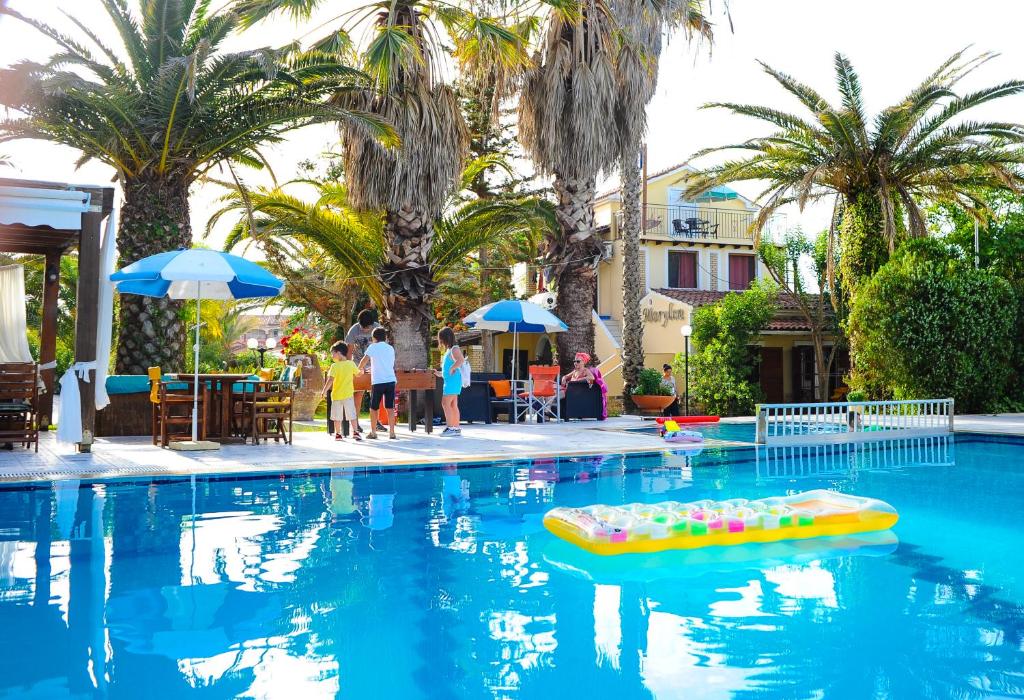 a pool with a raft of balls in the water at Marylin in Sidari