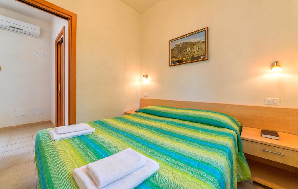 Postel nebo postele na pokoji v ubytování Lilybeo Village