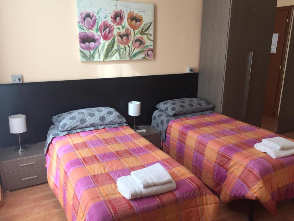 Łóżko lub łóżka w pokoju w obiekcie Locanda Beatrice