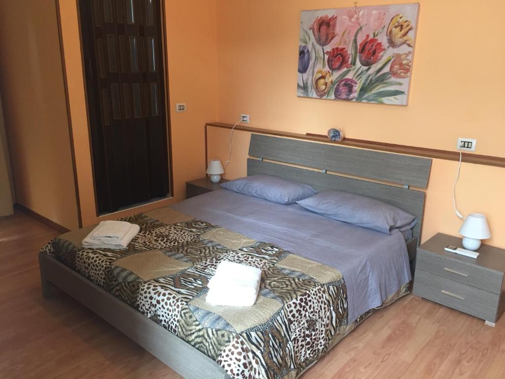 Łóżko lub łóżka w pokoju w obiekcie Locanda Beatrice