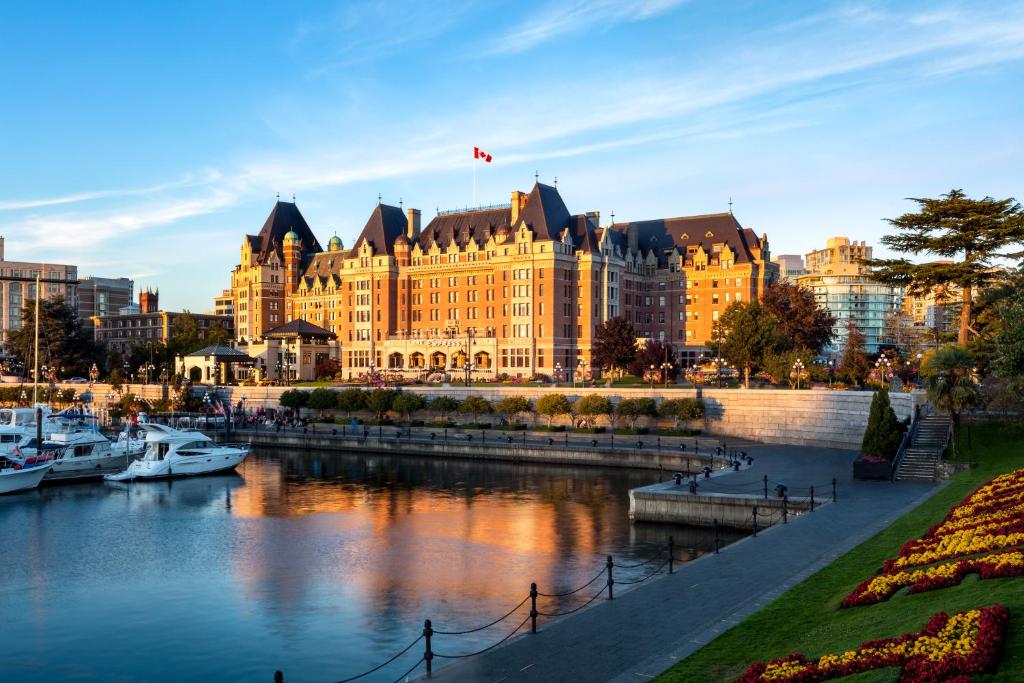 
a large building with a clock tower in front of it at Fairmont Empress Hotel in Victoria
