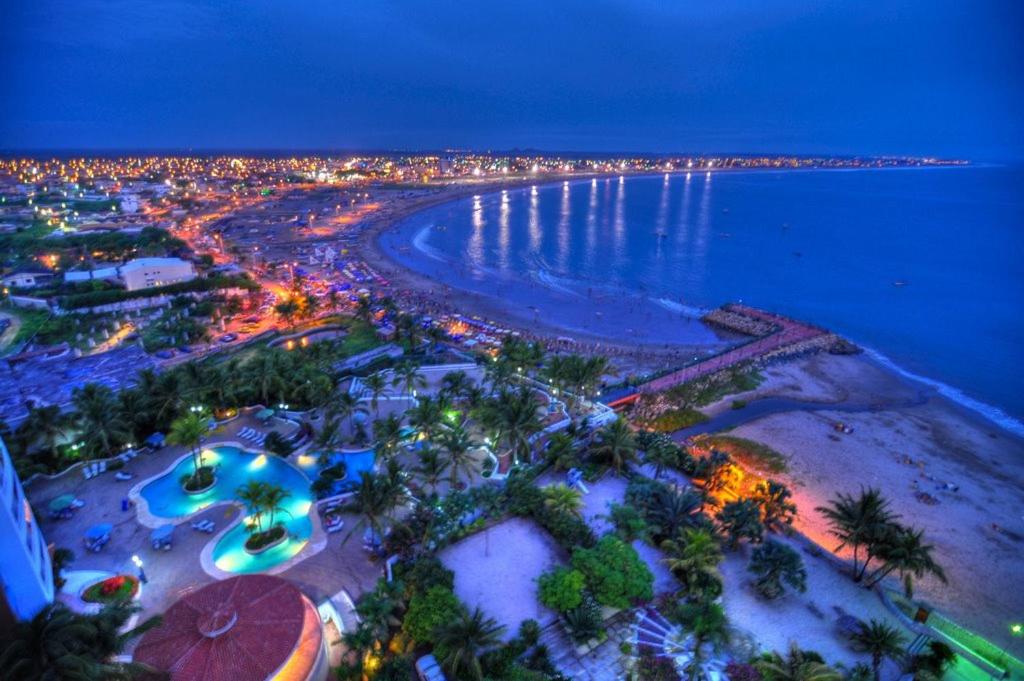 an aerial view of the beach at night at Frente al mar Carabelas de Colon in Playas