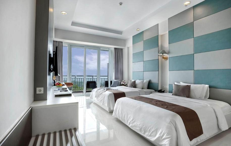 A bed or beds in a room at R Hotel Rancamaya