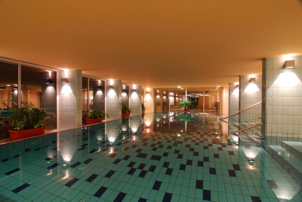 a lobby of a building with a tile floor at Hotel Princess in Bar