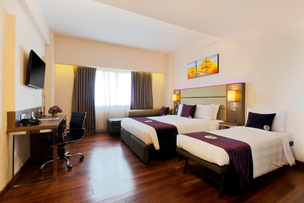 Postel nebo postele na pokoji v ubytování Satoria Hotel Yogyakarta - CHSE Certified