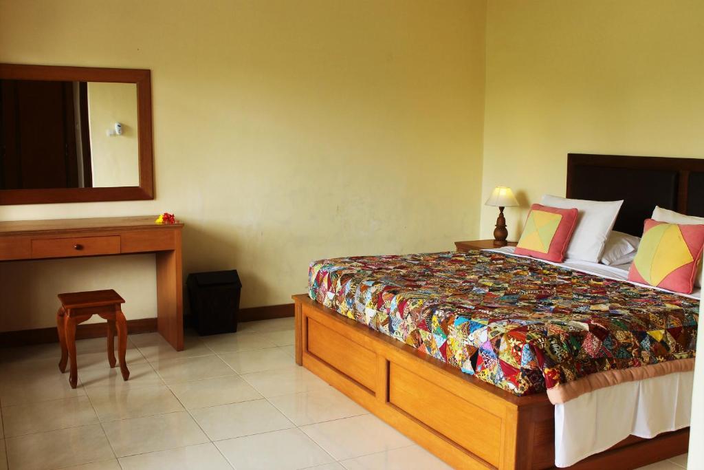 Postel nebo postele na pokoji v ubytování Cenik House Ubud