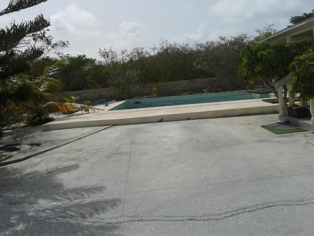 a swimming pool in the middle of a driveway at Sagusta Gardens PLS in Providenciales