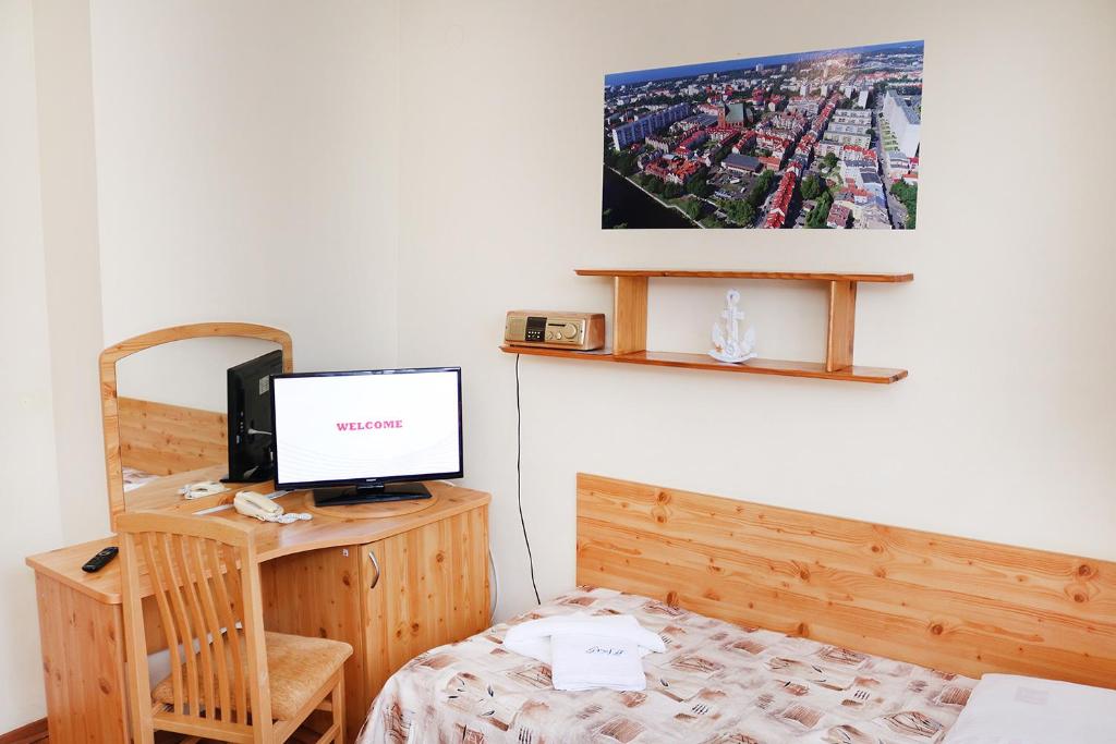 Postel nebo postele na pokoji v ubytování Ośrodek Wypoczynkowy Gryf II